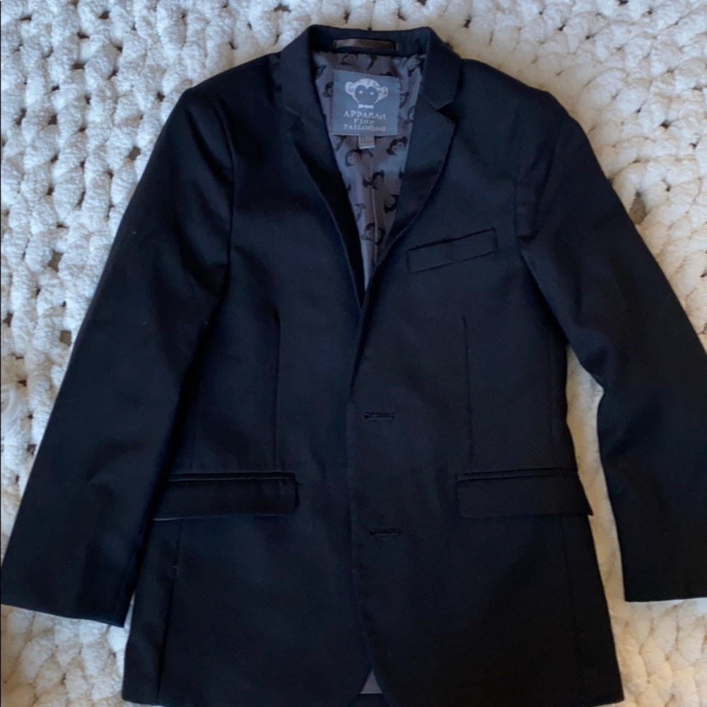Boys brand new lined black suit jacket.